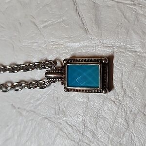 Turquoise simulant gem pendant in silver setting